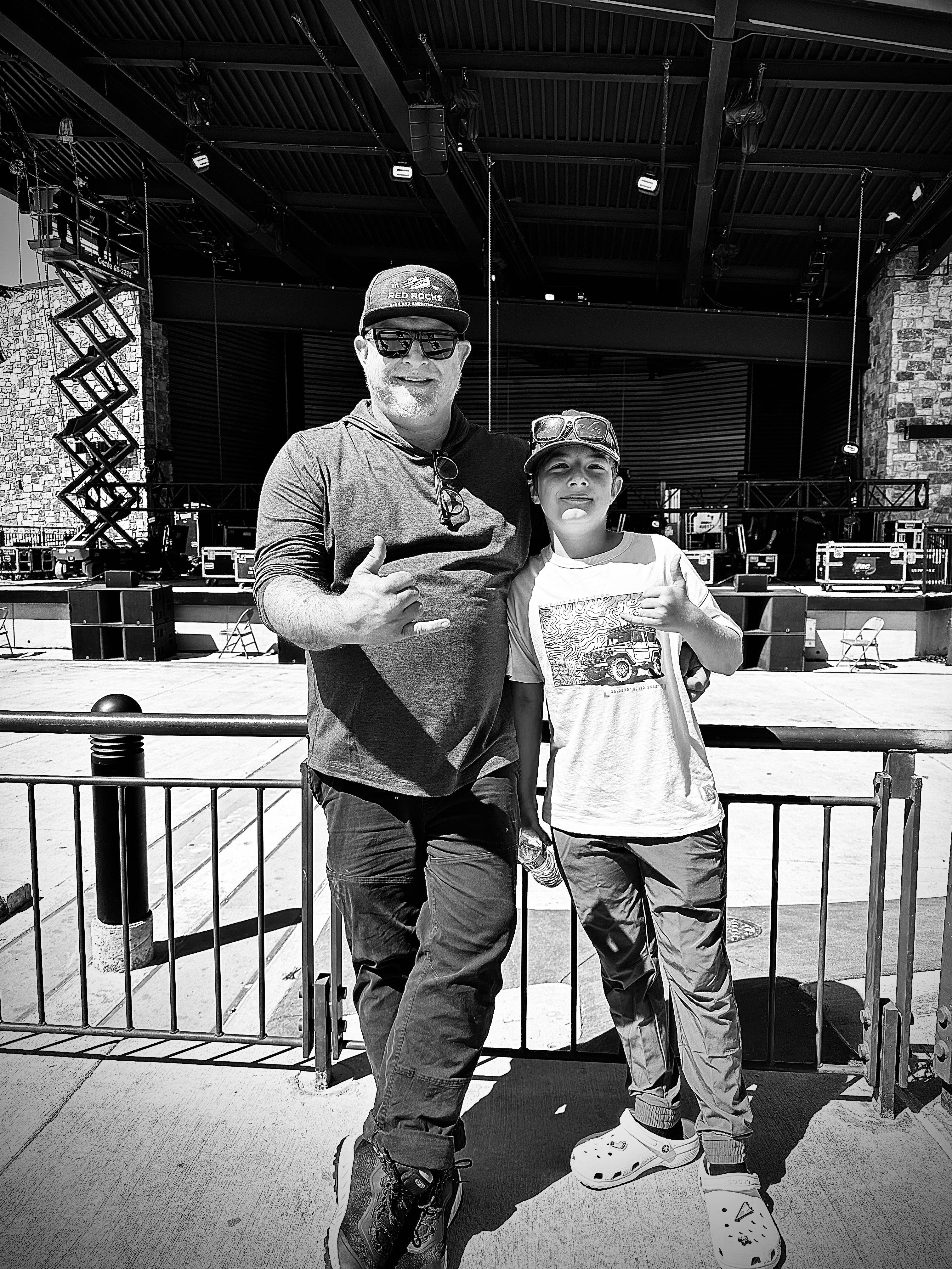 Black-and-white photograph of Vincent Adam Paul and a child at a concert venue