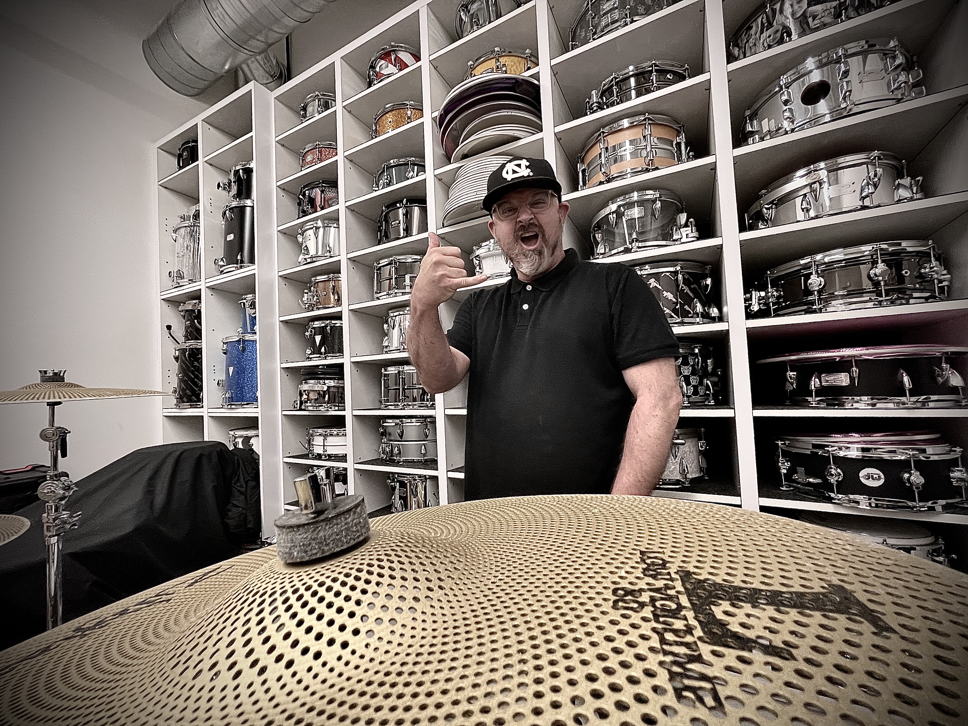 Vincent Adam Paul in a room lined with drums